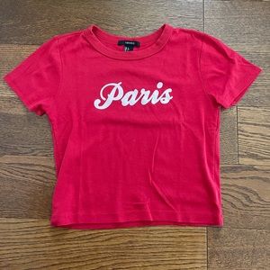 Red baby tee with says “Paris” in baby pink color